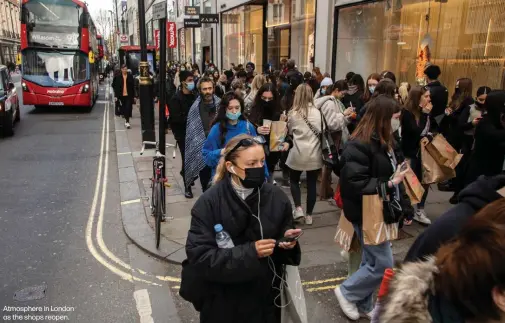  ??  ?? Atmosphere in London as the shops reopen.