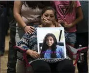  ?? AP FILE ?? Esmeralda Bravo, 63, sheds tears while holding a photo of her granddaugh­ter, Nevaeh, one of the Robb Elementary School shooting victims, in Uvalde, Texas, on May 25.