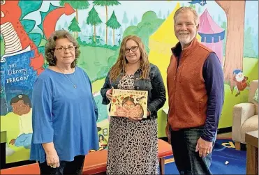  ?? Contribute­d ?? The Polk County Farm Bureau delivered a copy of the book “I Love Strawberri­es” to local libraries on Wednesday, March 22. Shown are Polk office manager Sue Cuzzort (from left), Cedartown Library Branch Manager Christina Lewis, and Polk County Farm Bureau Vice President Jackie Casey.