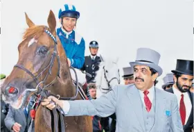  ??  ?? First class: Sheikh Hamdan Al Maktoum leads Nashwan after winning the Derby in 1989