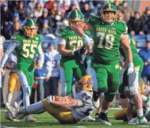  ?? ?? Newark Catholic’s Daniel Gray (78) and Nate Willis (58) celebrate after a defensive stop.