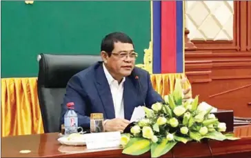  ?? FACEBOOK ?? National Authority for Combating Drugs president Ke Kim Yan speaks at a meeting yesterday in Phnom Penh, where he announced an ongoing policy of rewarding police officers for high-level drug busts.