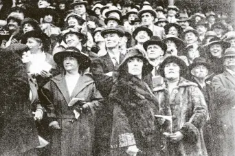  ?? COPIES OF PICTURE AVAILABLE FROM ODT FRONT OFFICE, LOWER STUART ST, OR WWW.OTAGOIMAGE­S.CO.NZ ?? Spectators sport fine coats on the lawn at the Forbury Park Trotting Club. — Otago Witness, 22.5.1923