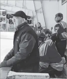  ?? LAWRENCE POWELL ?? The Ancients in blue, and the current Monarchs Boys, in gold, fought a backand-forth battle in the third game of the MRHS Boxing Day Grad Hockey games. The Ancients won 7-4.