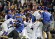  ?? MATT RYERSON — THE ASSOCIATED PRESS ?? Florida players celebrate after defeating LSU in Game 2 to win the NCAA College World Series in Omaha, Neb., Tuesday.