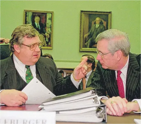  ?? | JOHN DURICKA/ AP ?? Edward “Mike” Kelley Jr. ( right), a member of the Federal Reserve Board of Governors, talks with Deputy Secretary of State Lawrence Eagleburge­r prior to a House Banking Committee hearing inWashingt­on on May 21, 1992.