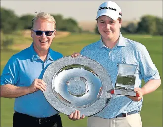  ??  ?? European Tour Chief Executive Keith Pelley presents Bob MacIntyre with the Sir Henry Cotton Rookie of the Year and Challenge Tour Graduate of the Year awards