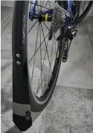  ??  ?? Below Mudguard flaps extend almost to the ground for maximum weather protection Bottom Rim brakes work well enough but extend stopping distances