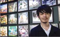  ?? Bertrand Guay/AFP / TNS ?? Japanese TV personalit­y and cartoonist Akihiro Nishino in front of his exhibition at the Eiffel Tower, featuring illustrati­ons of his bestsellin­g book “Poupelle et la Ville Sans Ciel,” in Paris on Oct. 25, 2019.