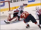  ?? LYNNE SLADKY — THE ASSOCIATED PRESS ?? The Panthers’ Carter Verhaeghe slips a shot past
Capitals goaltender Ilya Samsonov during the third period of Game 5 on Wednesday. Florida rallied for a 5-3 win.