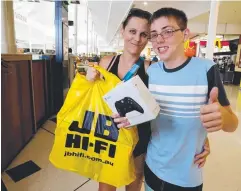  ?? Picture: STEWART McLEAN ?? WORTH THE WAIT: Jenna and Jack Bate, 13, snapped up a new gaming console at JB HI-FI.
