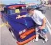  ?? ADOLPHE PIERRE-LOUIS/ JOURNAL ?? Curt Flora of Corrales cleans his wife Suzanne HuffFlora’s 1958 GMC pickup truck on display at Summerfest.