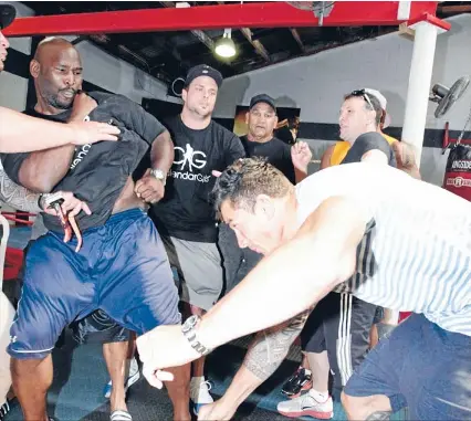  ?? Photo: FAIRFAX NZ ?? Premature exchange: Clarence Tillman, left, and Sonny Bill Williams in combative mood at the official weigh-in yesterday ahead of tonight’s fight in Hamilton.