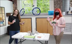  ??  ?? Schuylkill River Greenways education director Sarah Crothers, left, and Alliance for Watershed Education of the Delaware River fellow Veronica Wynn, right, pose for a photo with all the materials included in a Schuylkill Explorers Kit.