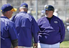  ?? DAVID M. JOHNSON - THE ASSOCIATED PRESS ?? Saratoga Catholic varsity baseball coach Phonsey Lambert talks to his coaching staff during a WAC game against Canajohari­e Thursday, April 28, 2016 at Veterans Memorial Park in Saratoga Springs.