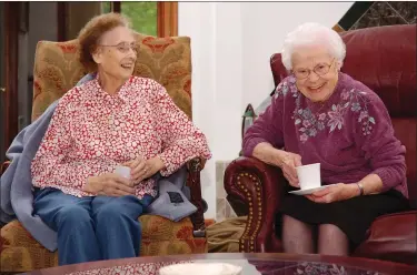  ?? SUBMITTED PHOTO ?? “Seniors Helping Seniors” is a service that provides companions­hip to seniors, as well as their senior caregiver. Officials said often times the two become friends, such as these two women laughing together over a cup of coffee.