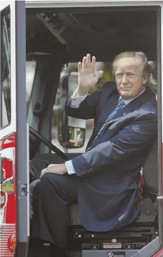  ?? AP PHOTO ?? ‘WHERE’S THE FIRE?’: President Trump promoted American-made products yesterday, including a Michigan-made firetruck, above, during ‘Made in America Week.’