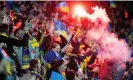  ?? Photograph: Mateusz Slodkowski/Getty Images ?? Ukraine fans light up the stands at the Wroclaw Stadium.