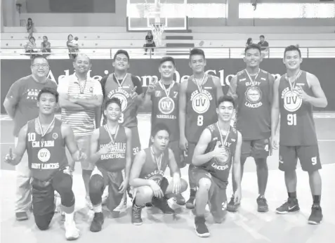  ??  ?? The University of the Visayas celebrates after snaring the Under 19 title of the Conference the other day at the Magis Eagle Arena.
Cebu Youth Basketball League Third