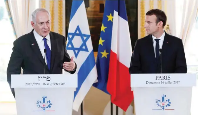  ??  ?? PARIS: French President Emmanuel Macron, right, and Israeli Prime Minister Benjamin Netanyahu, left, give a joint press conference at the Elysee Palace in Paris. — AFP