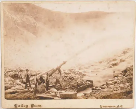  ??  ?? A vintage print depicts miners blasting a hillside with a water cannon at the Van Winkle Hydraulic Mine in Lytton, circa 1890s. The print is from the Townley Collection of Early Vancouver, British Columbia and Canadian Pacific Railway Photograph­s, which is being sold by the Wayfarer's Bookshop.