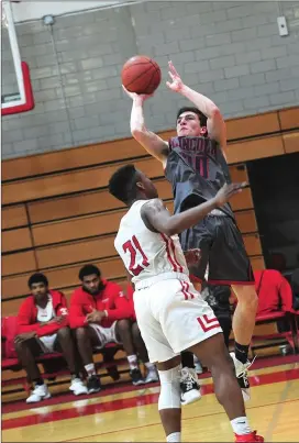  ?? Photo by Ernest A. Brown ?? Lincoln senior Vinny Nassi, right, scored a team-high 26 points in the No. 11 Lions’ 10382 defeat to talented East Providence in the first round of the Open tournament.