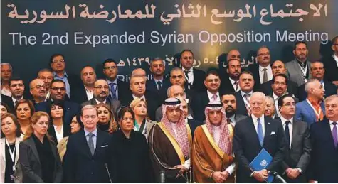  ?? AFP ?? Saudi Minister of Arab Gulf Affairs Thamer Al Sabhan (centre), Saudi Foreign Minister Adel Al Jubeir (centre right) and UN special envoy for Syria Staffan de Mistura (3rd from left) in a group picture during the Syrian opposition meeting in Riyadh,