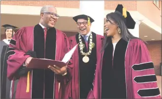  ?? Bo Emerson / Associated Press ?? Robert F. Smith, left, laughs with David Thomas and actress Angela Bassett at Morehouse College on Sunday in Atlanta.
