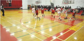  ??  ?? A high school girls basketball game underway on the Central Collegiate gym floor. The school is in the midst of a campaign to have the aging playing surface replaced in the near future.