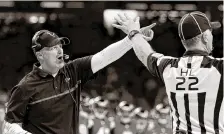  ?? THE ASSOCIATED PRESS ?? Atlanta Falcons coach Dan Quinn challenges an official in the first half of their 45-32 victory over the Saints in New Orleans on Monday night.