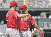  ?? Elaine Thompson Associated Press ?? THE ANGELS’ Albert Pujols, left, greets teammate Brian Goodwin after Goodwin’s two-run home run.