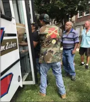  ?? SUBMITTED PHOTO ?? Volunteers for Veterans Making a Difference load the donations into the Zuber bus collected by agents of Zuber Realty and Zuber Insurance and student helpers.