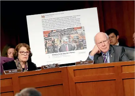  ?? PHOTO: REUTERS ?? Democratic senators Dianne Feinstein and Pat Leahy display a picture of a fake social media post for a non-existent ‘‘Miners For Trump’’ rally as representa­tives of Twitter, Facebook and Google testify about how Russia allegedly used their services to...