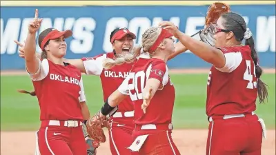  ?? Oklahoma Softball ?? Oklahoma third baseman Jana Johns (20) celebrates with teammates on the field following her team’s 7-1 win over James Madison Monday to advance to the WCWS championsh­ip series. Johns is a former Calhoun High School standout who started her college career at South Carolina.