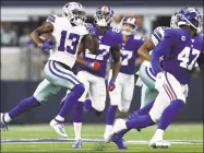  ?? Ronald Martinez / Getty Images ?? The Cowboys’ Michael Gallup (13) makes a catchandru­n for 62 yards against the Giants Sunday.