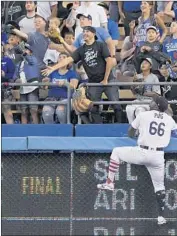  ?? Mark J. Terrill Associated Press ?? DODGERS’ Yasiel Puig climbs the wall as he watches a ball hit by Pittsburgh’s Gregory Polanco go out.