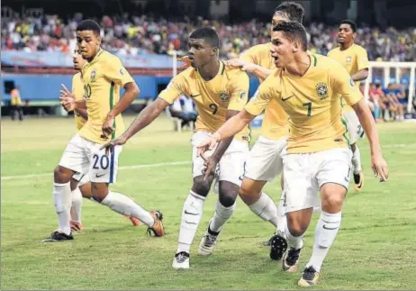  ?? FIFA VIA GETTY IMAGES ?? Brazil’s Lincoln (centre) celebrates with teammates after equalising against Spain during their FIFA U17 World Cup match in Kochi. Brazil won 21.