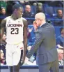  ?? Stephen Dunn / Associated Press ?? UConn’s Akok Akok has remained positive while working through what he calls a “boring” rehab regimen.