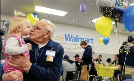  ?? TANIA BARRICKLO — DAILY FREEMAN ?? Harry Scarth kisses his great-great-grandaught­er, 19-month-old Sophia Rhea, during his retirement party Friday at the Walmart Supercente­r store in the town of Ulster. Scarth, 91, has worked at the store since it opened 19 years ago. Sophia is the...