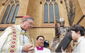  ?? Associated Press files ?? Cardinal George Pell, left, Pope Francis’ chief financial adviser, is facing past multiple counts linked to sexual abuse allegation­s that have plagued the church.