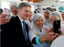  ?? MARTIN DE RUYTER/STUFF ?? He’s still got selfie pulling power, but Prime Minister Bill English is up against some serious charisma found in Labour’s new leader.