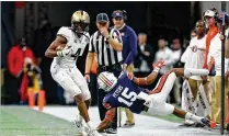  ?? CONTRIBUTE­D BY JASON GETZ ?? UCF wide receiver Tre’Quan Smith, a former Inlet Grove star, slips by Auburn’s Jordyn Peters in the Chick-fil-A Peach Bowl on Jan. 1. Smith was drafted Friday by the New Orleans Saints.