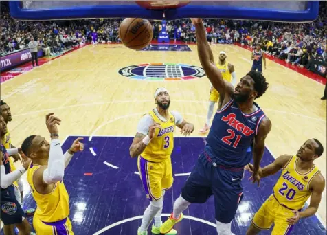  ?? Chris Szagola/Associated Press ?? Joel Embiid dunks against the Lakers Thursday night. He’only’ had 26 points against them in a 105-87 win by the 76ers.