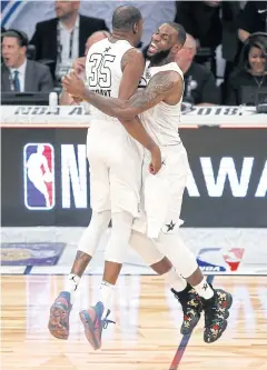  ?? AP ?? Team LeBron’s Kevin Durant, left, and LeBron James celebrate scoring against Team Stephen in the All-Star Game.