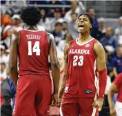  ?? AP ?? Alabama forward Nick Pringle (23) reacts after the Crimson Tide beat Auburn on Saturday. Alabama jumped from No. 3 to No. 1 in the latest AP Top 25 poll.