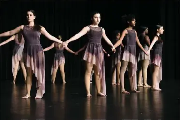  ?? The Sentinel-Record/Grace Brown ?? HIGHLIGHTI­NG JUSTICE: The Hot Springs Dance Troupe performs an original piece to “Strange Fruit” by Nina Simone Saturday during the 20th annual Dr. Martin Luther King Jr. Prayer Breakfast at Horner Hall in the Hot Springs Convention Center. The piece will be part of the routine that the troupe will perform in Austria, Germany and Italy in June when they travel with Young Tanzsommer.