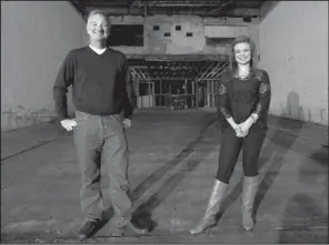  ?? NWA Media/DAVID GOTTSCHALK ?? Tom Lundstrum stands Friday with his daughter Gracie Lundstrum in the main part of the Apollo Theater in Springdale. Tom Lundstrum, co-owner of the theater, is hoping to restore it to how it looked in the 1950s.