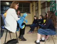  ??  ?? Dr. Carolyn Webster-Stratton interacts with girls in Marymount