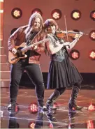  ?? TYLER GOLDEN/NBC ?? Chris Kroeze performed a guitar and fiddle duet for the finale of his cover of Garth Brooks’ “Callin’ Baton Rouge” during Monday’s episode of “The Voice.”