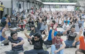  ?? Photo: Refugee Action Coalition ?? Refugees on Nauru protesting on April 7, 2015 at Anibare camp against offshore processing in defiance of a new law that requires protesters to give seven days notice of any protest and gives the police commission­er sole power to allow a protest, or not.